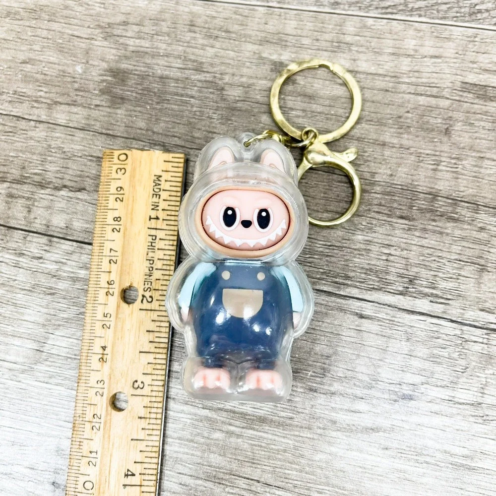 Labubu Monster Art Toy Keychain Blue Overalls Clear Protective Case Gold Tone